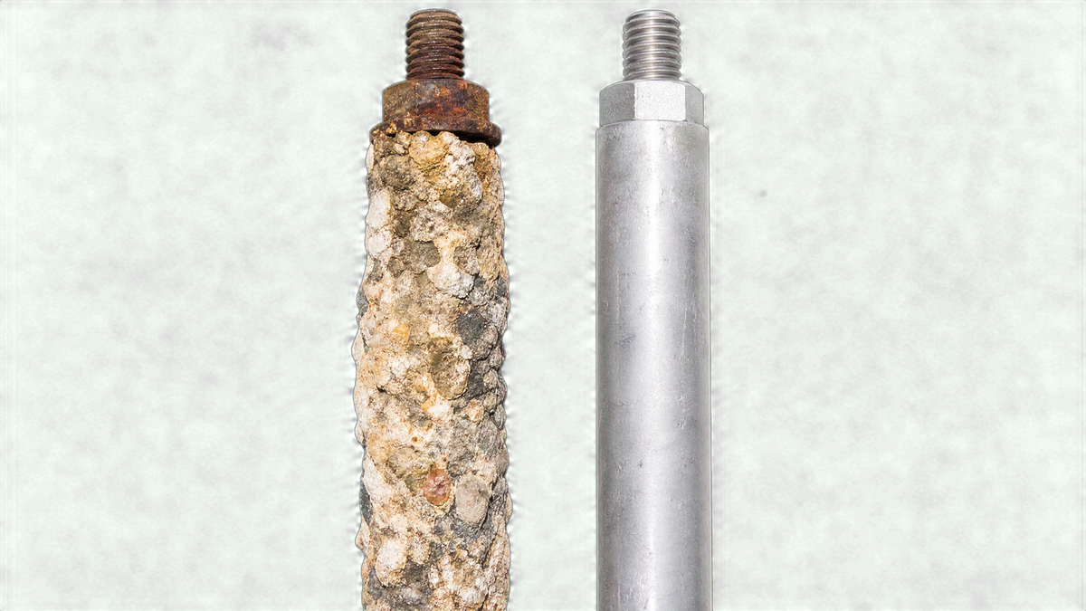 Comparison between a heavily corroded calcium-coated water heater anode rod and a new replacement rod